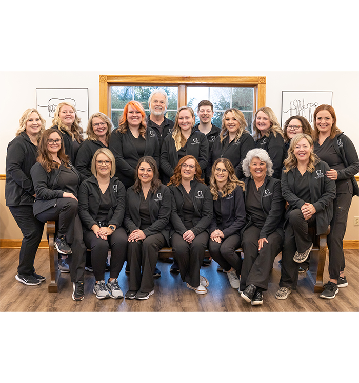 Smiling dentists and dental team at Corcoran Privitera Family Dental