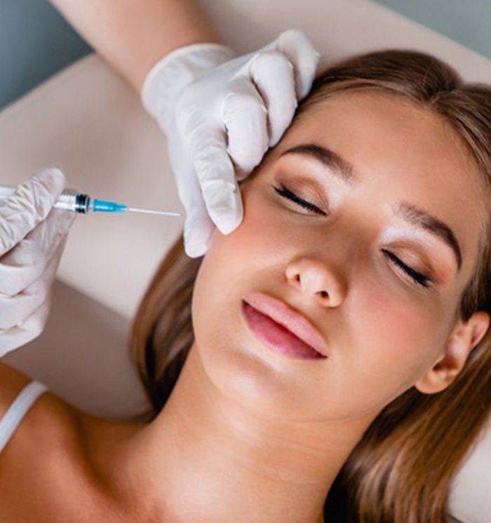 a woman undergoing BOTOX treatment