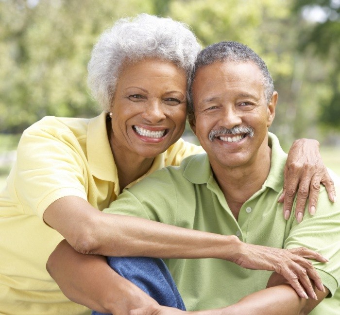 Senior couple smiling with dental implants in Waverly