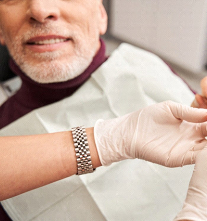 Dentist showing off a set of dentures