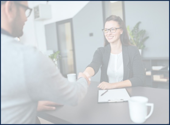 Man shaking hands with dental team member